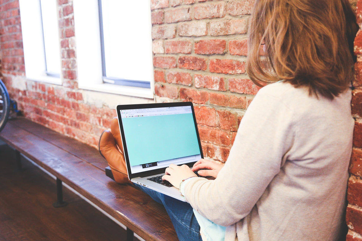 female student working on a computer